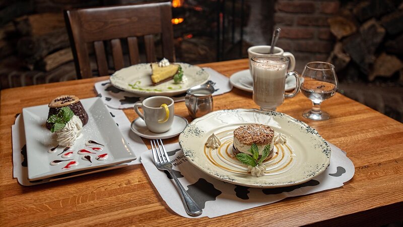 Table with several desserts and after dinner drinks