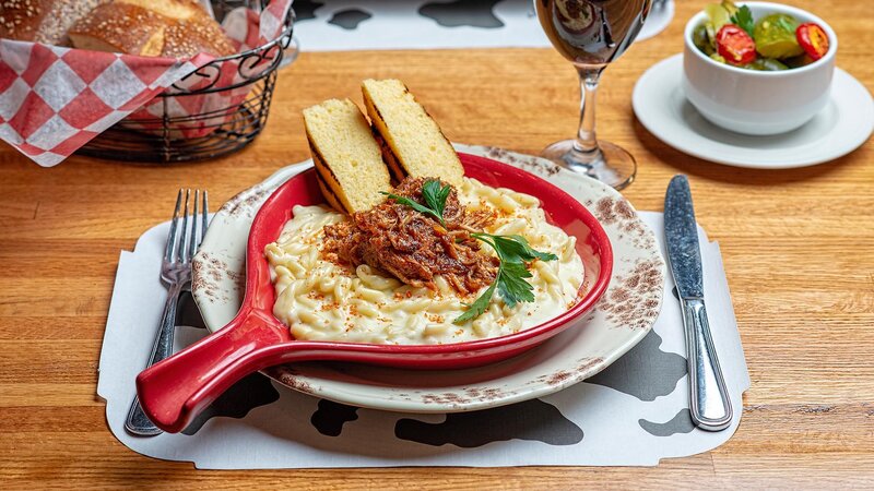 Mac and cheese topped with pulled pork